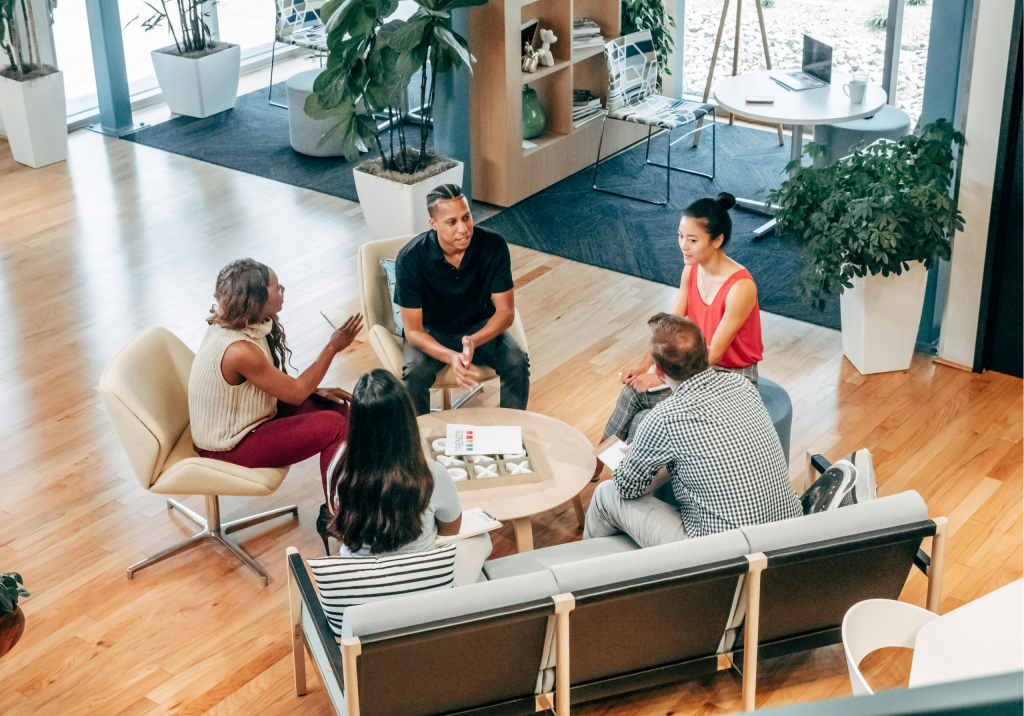 People Sitting on Chair in Front of Table