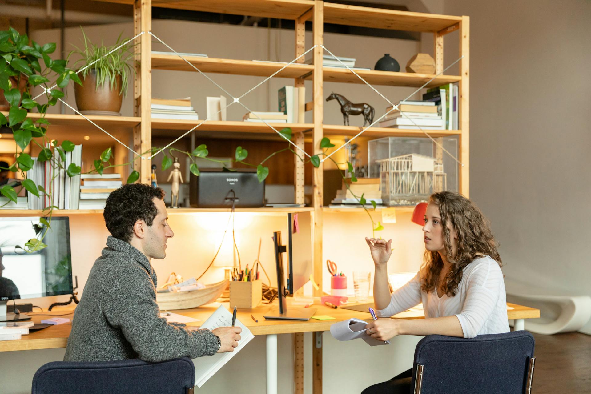 A Man and a Woman Collaborating at Work